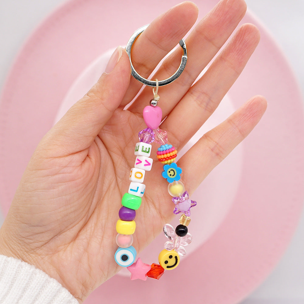 Factory direct supply handmade beaded mobile phone lanyard bluetooth speaker lanyard flashlight fan selfie stick U disk sling